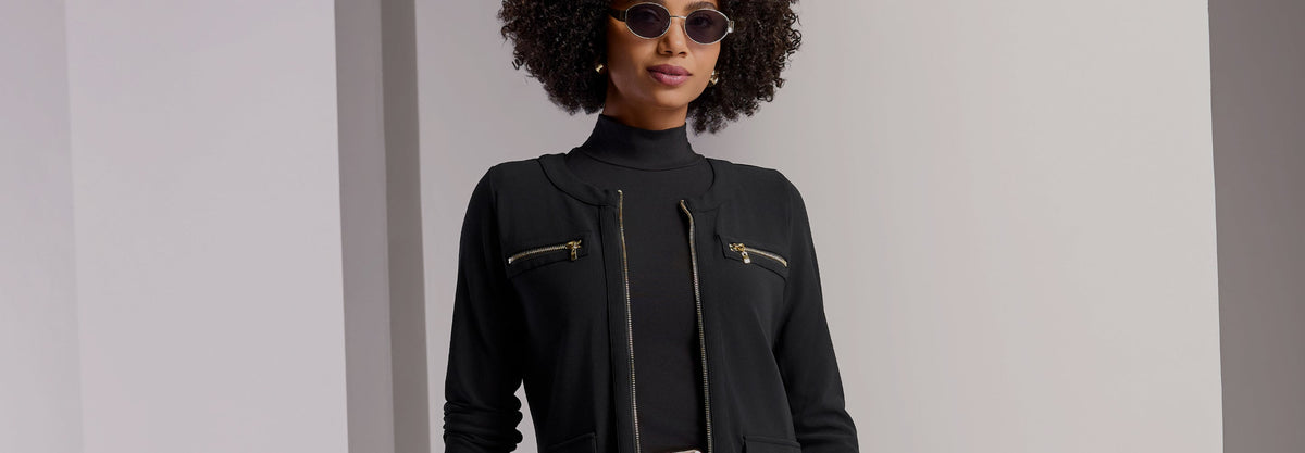 model wears black travel jacket
