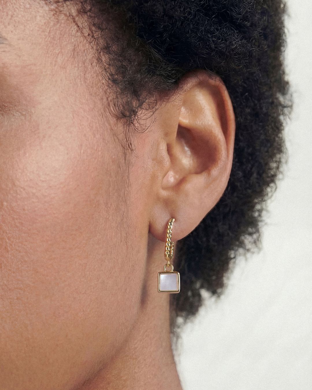 MOTHER-OF-PEARL CHARLOTTE DROP HUGGIE HOOPS