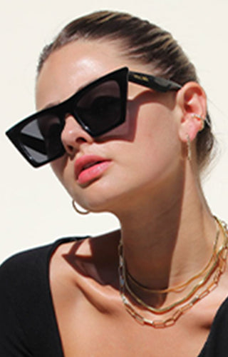 Model is wearing Fifth and Ninth sunglasses