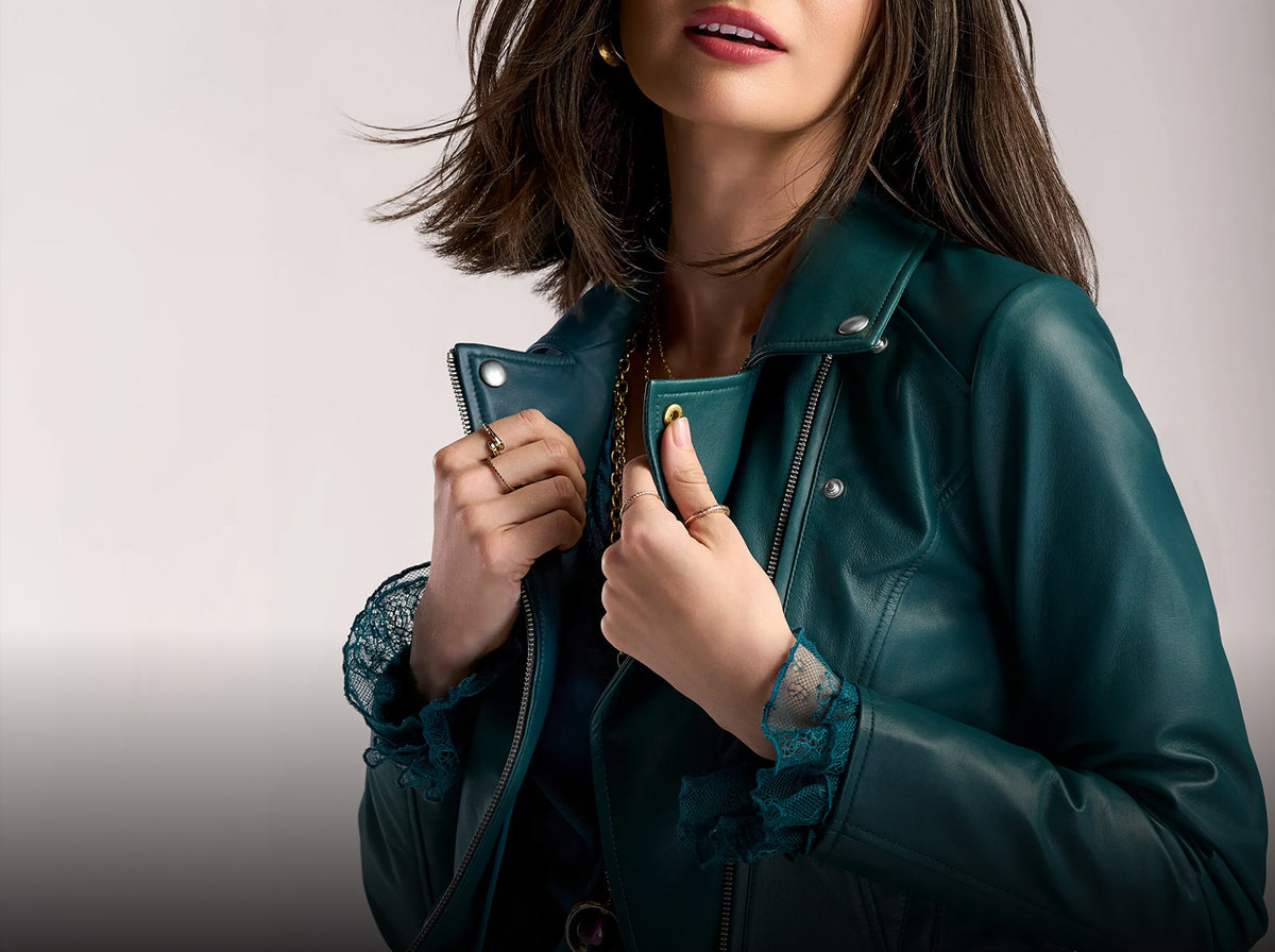 model wears teal jacket