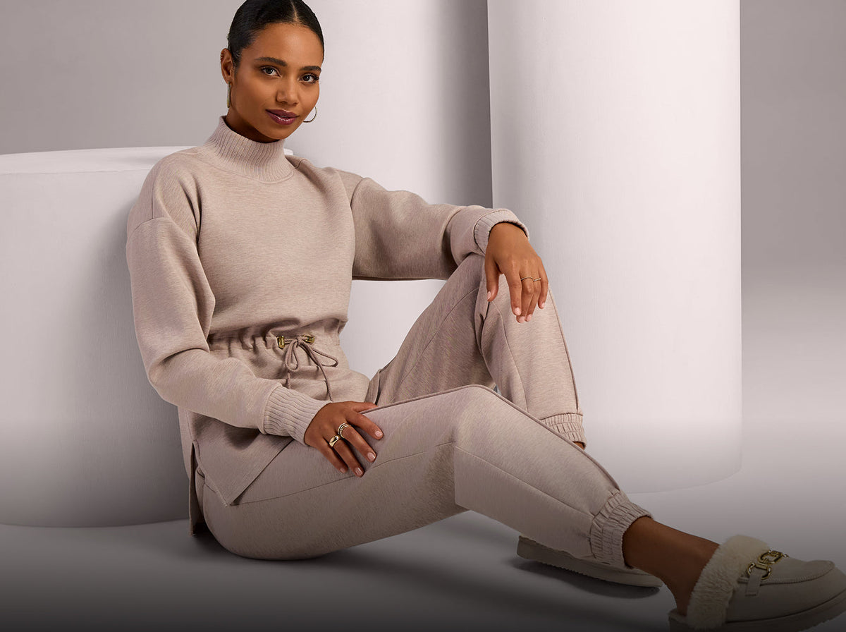 model wears tan athleisure set