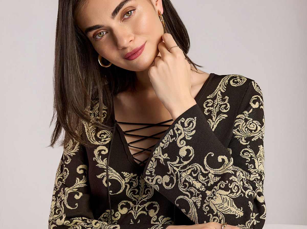 model wears abstract tunic sweater