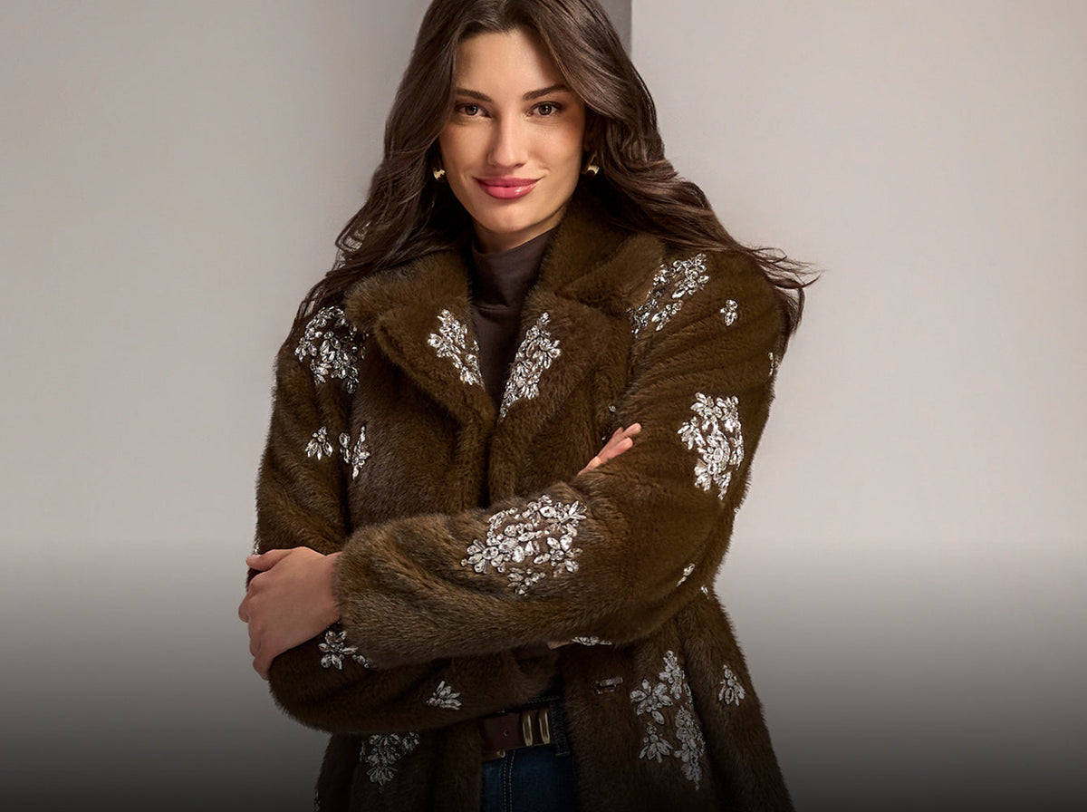 model wears embellished brown jacket