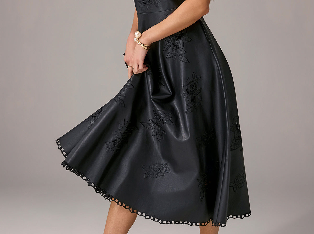 model wears faux leather dress