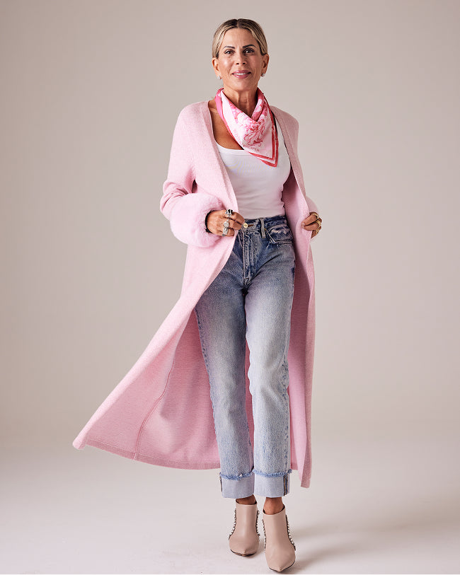 sheryl wears pink duster with jeans
