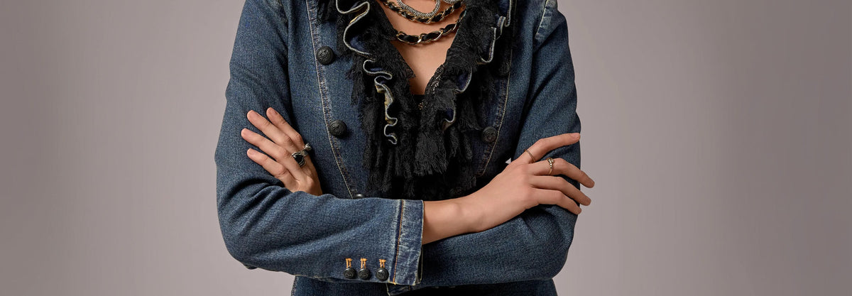 model wears denim jacket with black lace