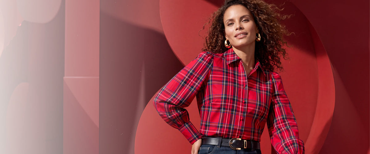 model wears red plaid button down