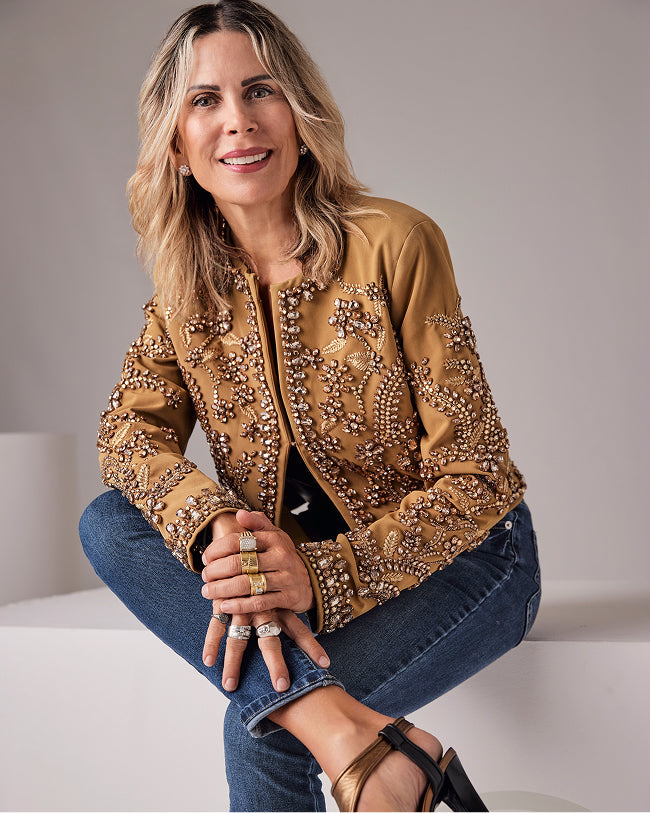 sheryl wears tan embellished jacket