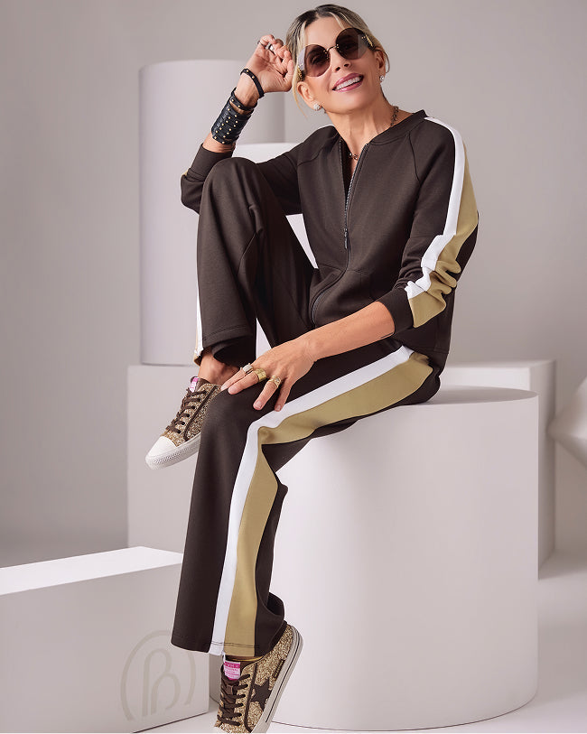 sheryl wears brown track suit