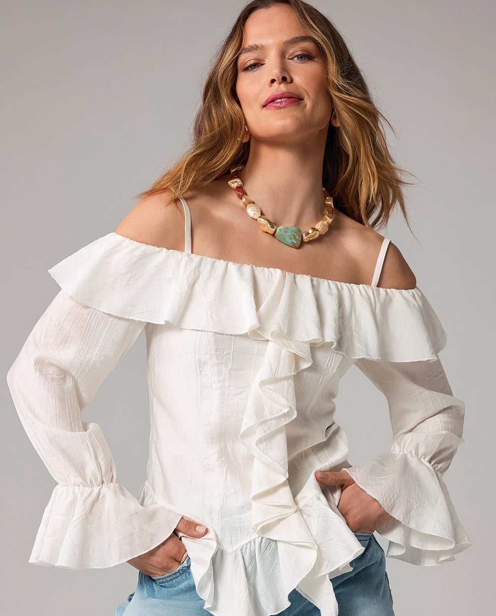 models wearing white ruffle top