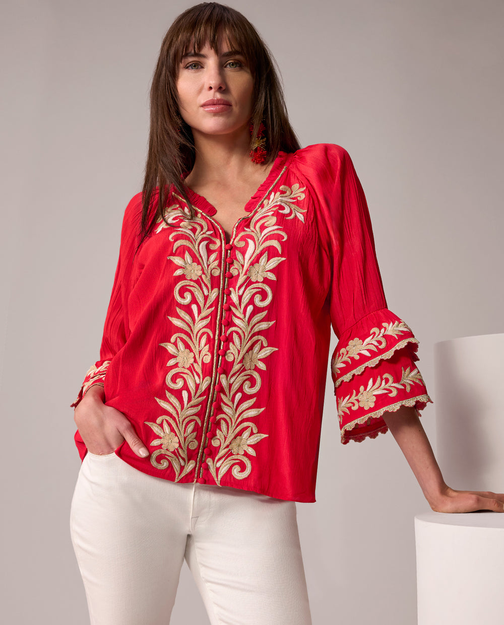 models wearing embroidered red top