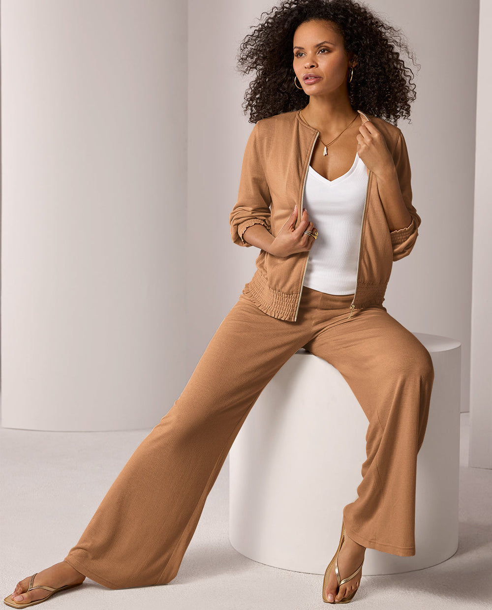 models wearing matching tan athleisure set