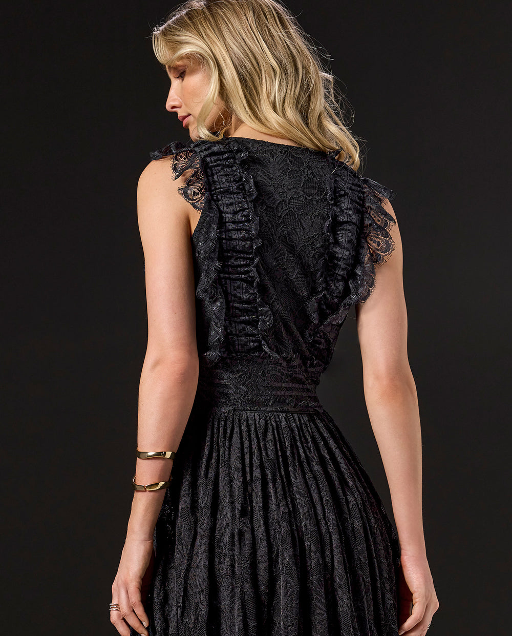 model is wearing black lace dress