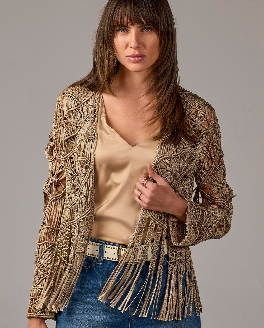 model is wearing fringe cardigan with tank tank