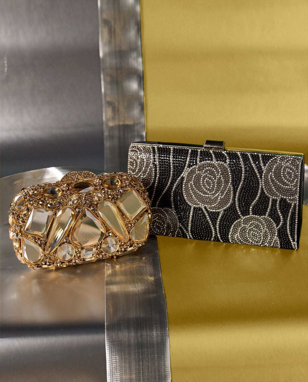 image shows two new embellished clutch purses