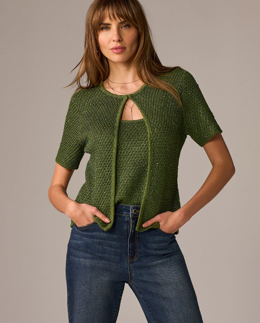 models wearing green tank and cardigan set