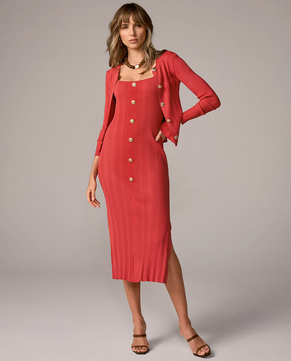 models wearing coral midi dress with matching cardigan