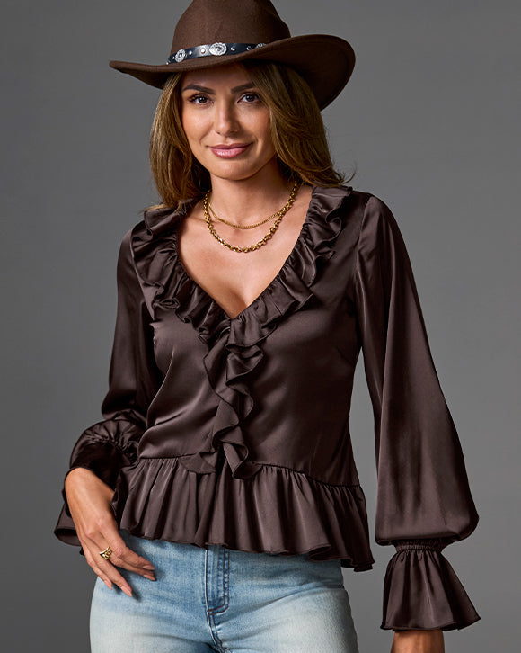 model is wearing brown flowy long sleeve top