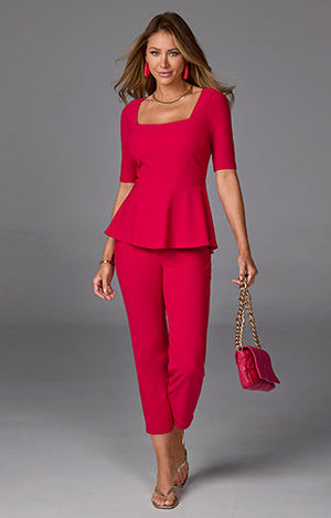 models wearing red peplum top with matching pants