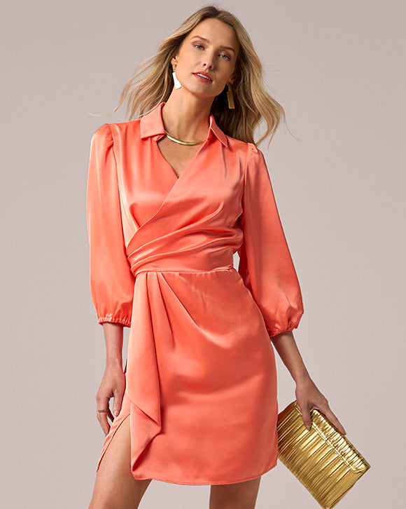 models wearing orange wrap dress