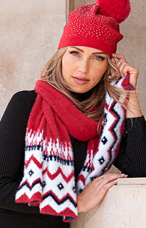 Model wearing red embellished hat and red multi scarf.