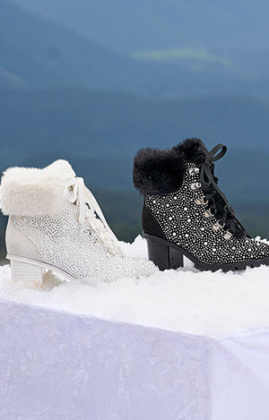 Black and white faux fur jeweled heel boots.