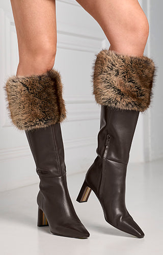 models wearing brown knee high boots with brown faux fur
