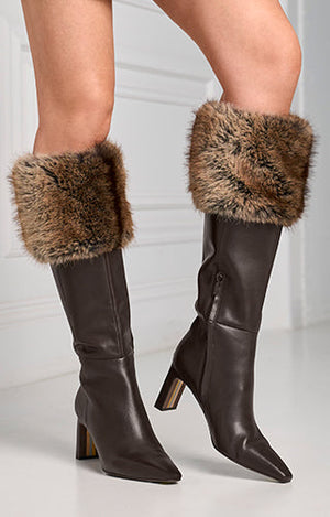 models wearing brown knee high boots with brown faux fur