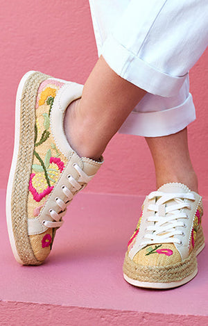 Close up of floral print natural sneakers.
